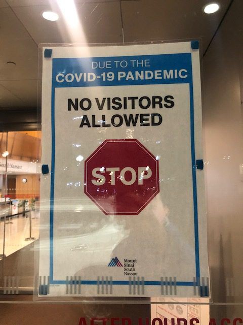 No visitors sign at hospital during COVID-19