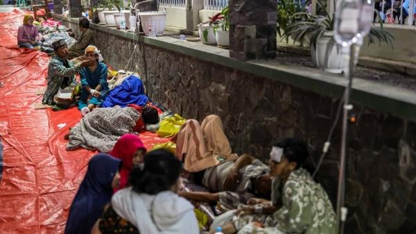 Injured people receive treatment at a hospital in Cianjur in the West Java province, Indonesia