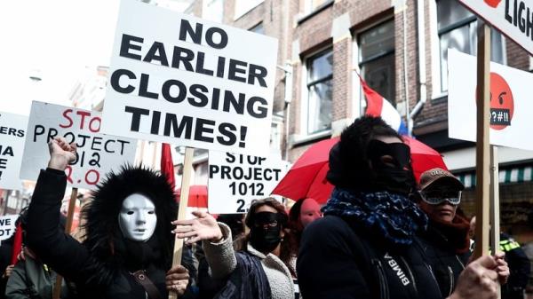 Many of the sex workers wore masks to hide their identity during the protest