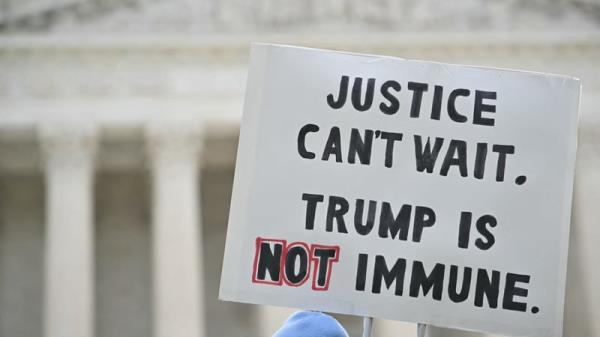Anti-Trump protesters demo<em></em>nstrate outside the US Supreme Court before the hearing
